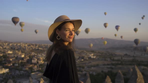 Happy Young Woman With Hat On Hot Air Balloons alt