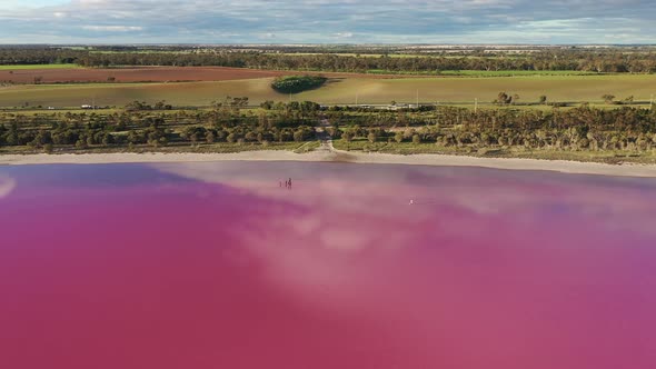 Pink Lake, South Australia. Drone clip circling the lake from above with traffic and paddocks in the alt