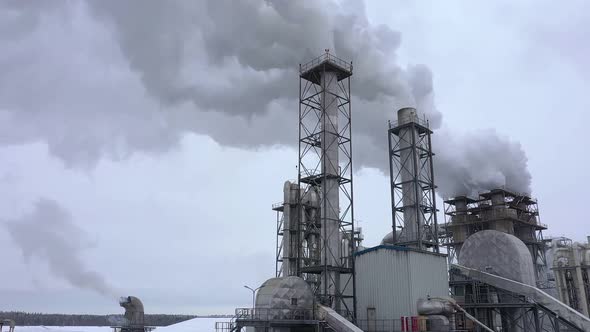 A Plant Pollutes the Atmosphere with Smoke From Pipes