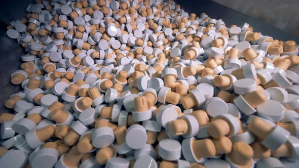 Pile of Bottle Lids, Close Up. Many Caps with Cork in One Container at a Factory alt