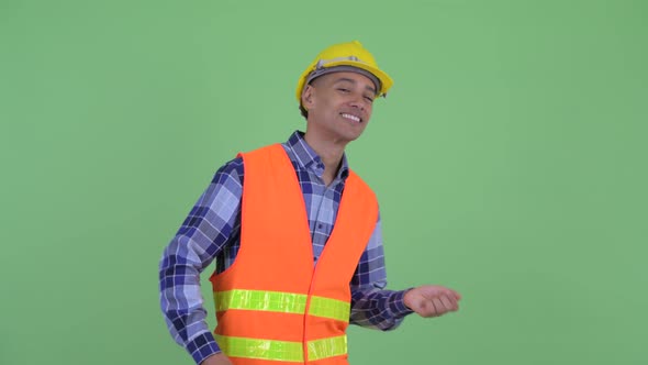 Happy Multi Ethnic Man Construction Worker Dancing alt