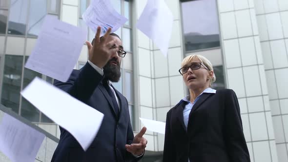 Angry Boss Throwing Papers in Front of Confused Secretary, Dissatisfactory Work