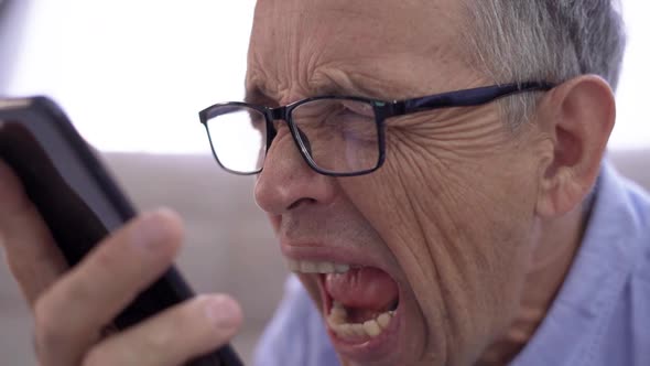 Angry Senior Businessman Shouting on the Phone He is Frustrated and Disappointed alt
