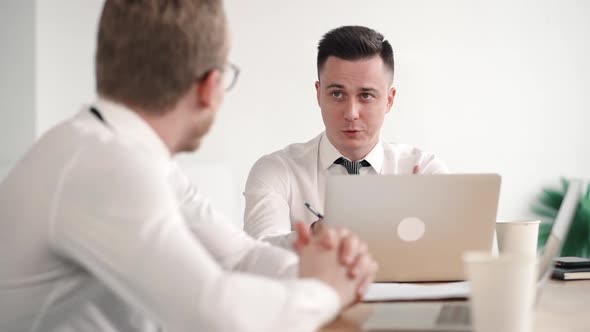 Two Confident Men in Modern White Office Negotiating, Planning Future Project with Positive Smile