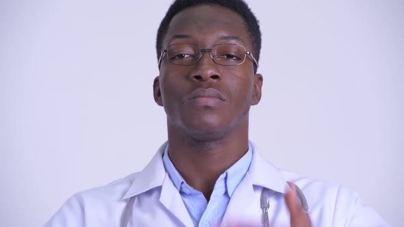Face of Young African Man Doctor Showing See No Evil Concept alt