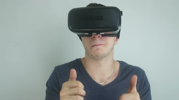 Man In The Modern Helmet Of Virtual Reality Sings And Dances