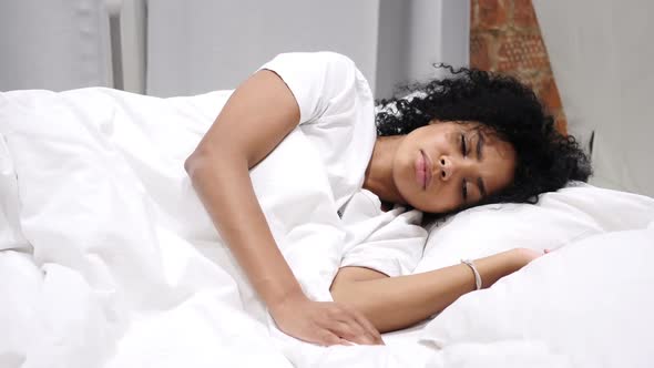 Uncomfortable AfroAmerican Woman Sleeping on Side in Bed at Night Restlessness alt