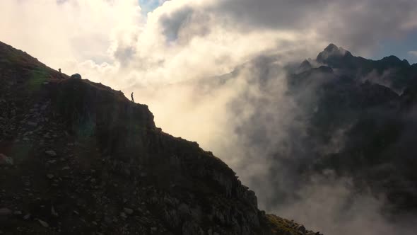 Hiker on the Edge of the Mountain alt