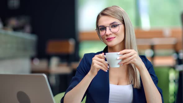 Happy Beautiful Young Businesswoman Relaxing Drinking Coffee at Restaurant Posing Looking at Camera alt
