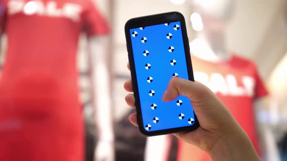 Vertical Scrolling of the Phone Screen in Women's Hands alt