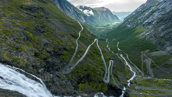 Serpentine Mountain Road Of Trollstigen With Stigfossen Waterfall In Norway. - timelapse alt