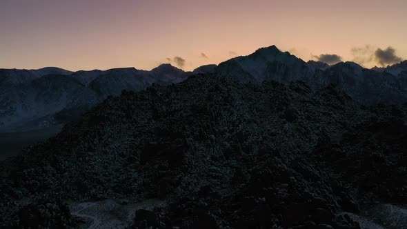 Amazing Landscape And Rock Mountains On Dusk In Alabama Hills, California USA. Aerial Slide Shot alt