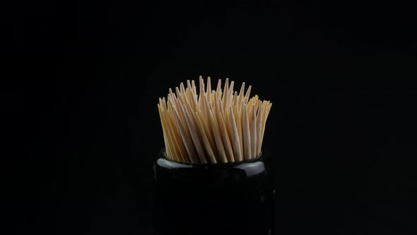 Close up of a group of wooden toothpicks alt