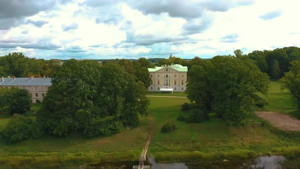 Mezotne Palace and Park Lielupe River With Ponton Bridge in the Background