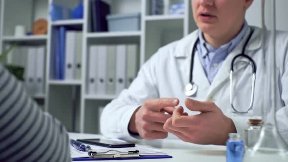 List Of Symptoms Of Patient On Tablet In Front Of Doctor. Male Doctor, Doctor Of Both Medicine Lists alt