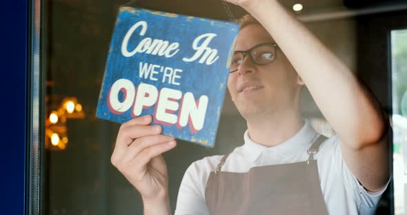 Restaurant Opening Waiter Owner Changes the Door Plate From Closed to Open