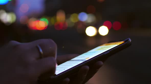 Girl Working on Mobile Phone at Night alt
