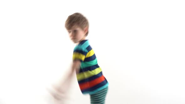 Little Boy in the Studio on a White Background Dancing Funny Dance