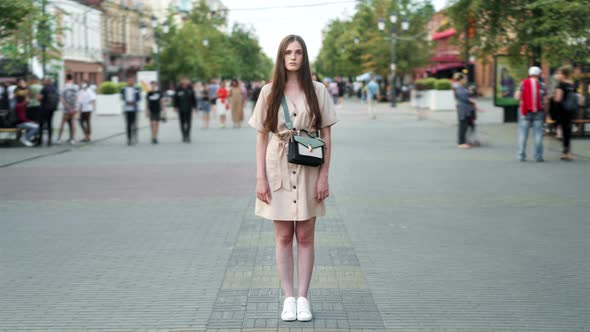 Time Lapse of Beautiful Female Student Standing Outdoors in Busy Street on Summer Day alt