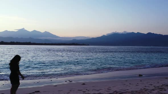 One girl happy and smiling on exotic island beach wildlife by blue lagoon with white sand background alt