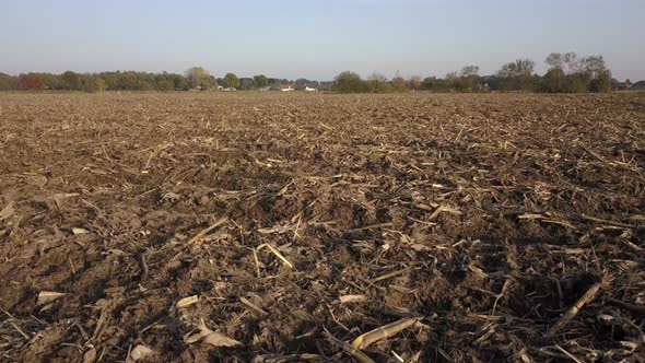 Aerial Cinematic Clip Drone Flying Over a Farm Field During Sunset alt