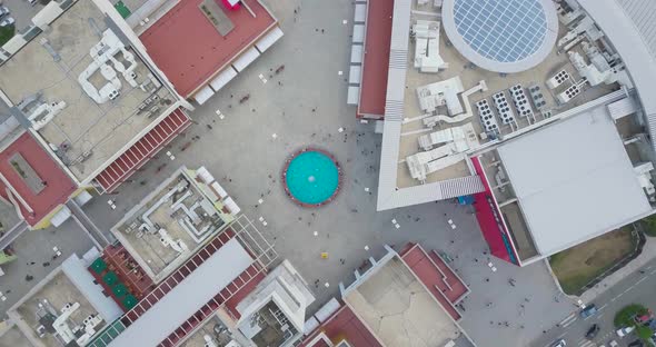 Top Aerial Overhead spinning up View Of Shopping Mall And Parking Lot
