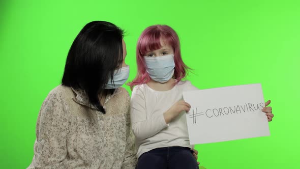 Sick Mother and Daughter in Mask Show Page with Message. Coronavirus Concept alt