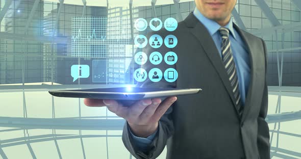 Man showing digitally generated medical icons on tablet alt