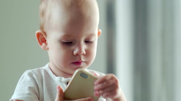 Cute Baby Boy Learning How to Call on the Phone