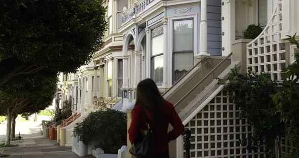 Woman walking in a city street alt