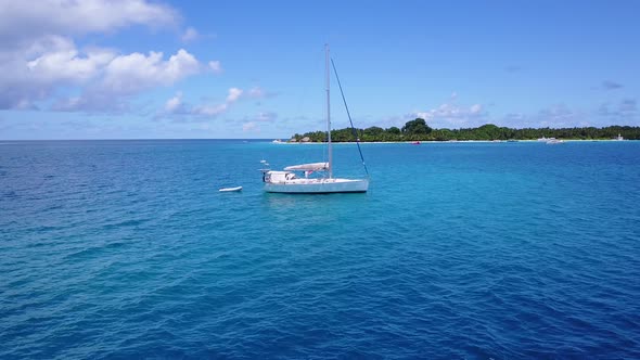 Daytime above abstract view of a summer white paradise sand beach and blue sea background in hi res  alt