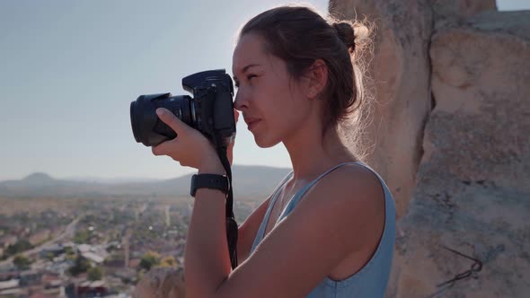 Female Photographer, Taking Pictures of Mountain Landscape at Sunset alt