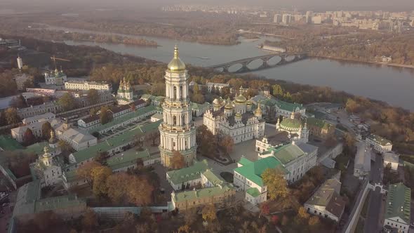 Aerial Kyiv Pechersk Lavra churches and monastery on hills of Dnipro river Ukraine alt