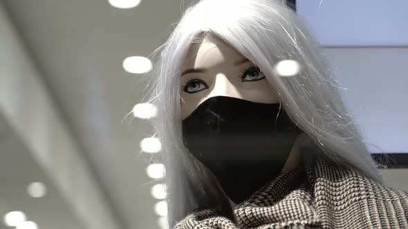 Mannequin in Protective Mask with Scarf in Fashion Store alt