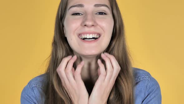 Close Up of Excited Amazed Woman in Surprise Isolated on Yellow Background alt