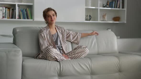 Beautiful Housewife Posing Sofa in Pajamas Before Breakfast alt