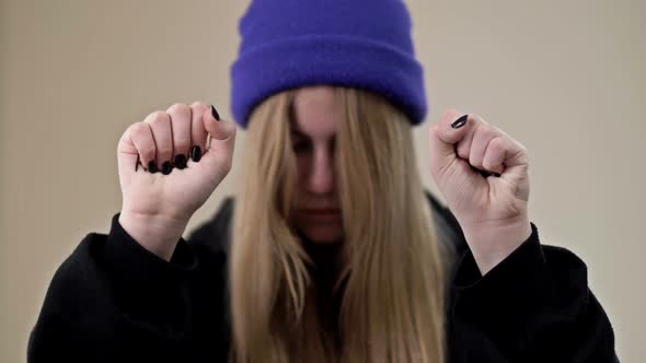 Portrait of a Frustrated Teenage Girl Showing Her Palms with the Inscription HELP ME