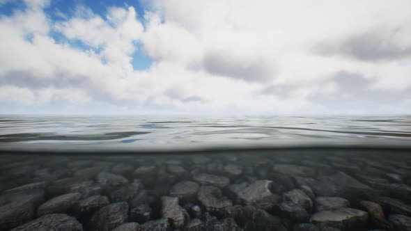 Ocean Seascape with Sky and Ocean Wave Splitted By Waterline to Underwater Part alt