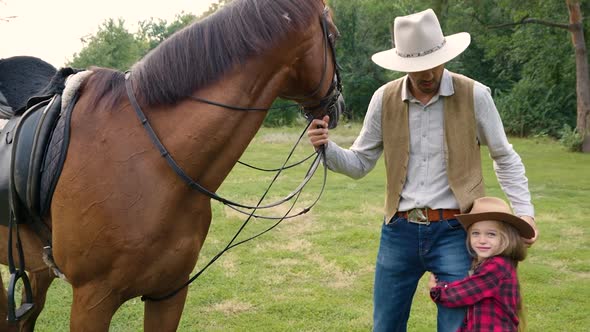 Cowboy and His Daughter with a Horse on the Lawn alt