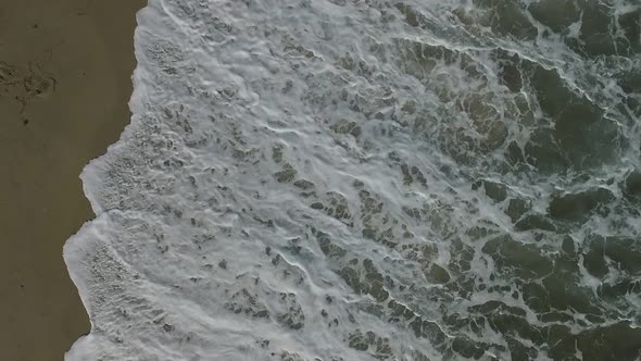 Aerial Drone View of Tropical Beach Ocean Waves Reaching Shore alt