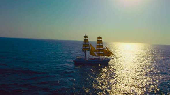 A blue sea with ship/boat silhouette view alt