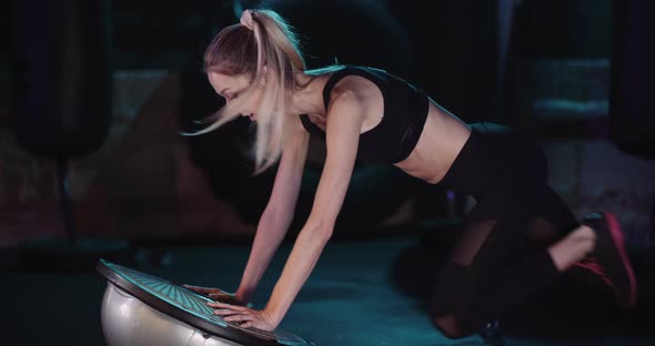 Sporty Woman Exercising At Health Club alt