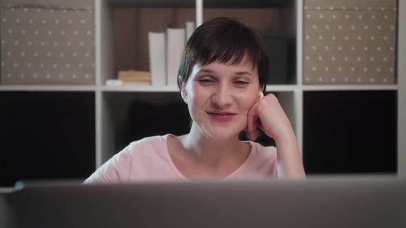 Happy young woman talking video calling on chatting with friends laughing enjoy online conversation alt