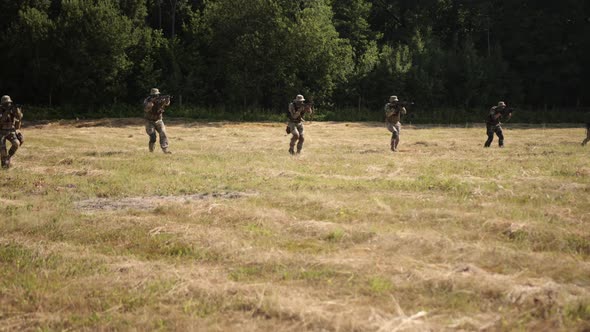 Military Special Forces Unit is on Battlefield Armed with Ammunition and Weapons to Attack Enemy alt