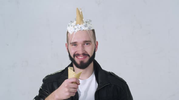 Portrait of Creative Funny Young Male with Ice Cream on Head