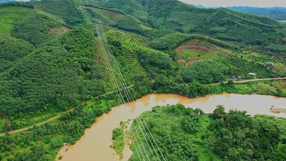 4K : Aerial view over farmland and hill farming alt