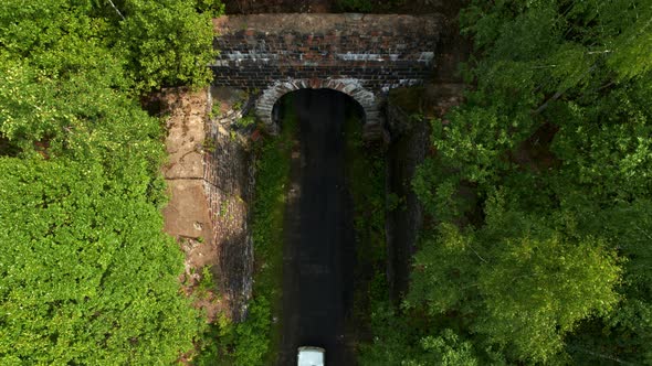 Aerial View of the Car Entering the Tunnel alt