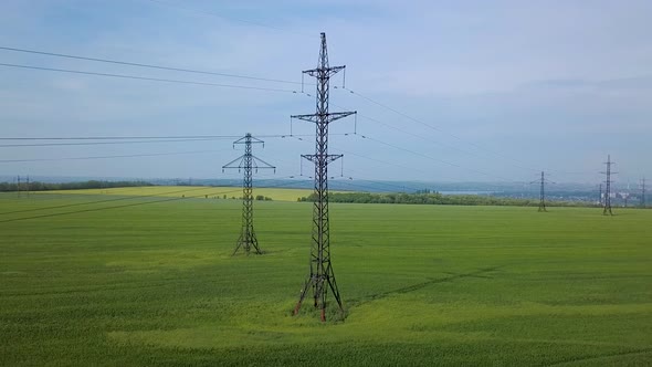 High-voltage Power Pylon on the Green Field alt