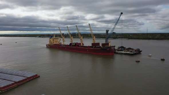 Aerial video of a ship being loaded on the Mississippi River in ...