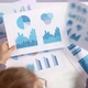 A business woman holds statistical data and charts of financial reports in her hands. - VideoHive Item for Sale